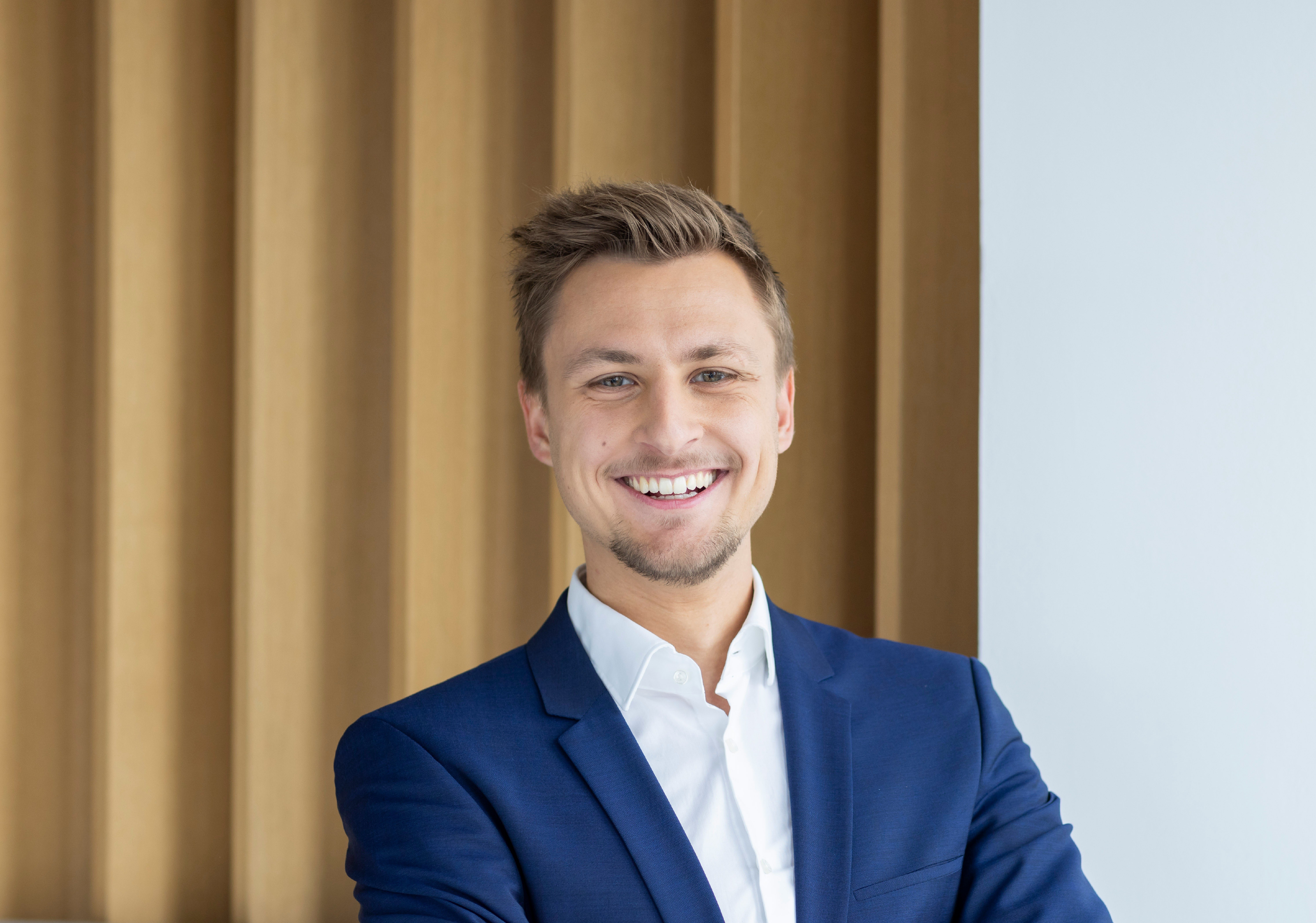 Professional portrait with subtle space-tech aesthetic